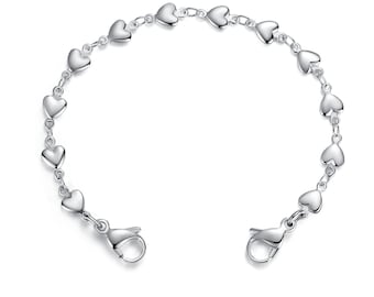 May include: A silver bracelet with a heart-shaped chain. The bracelet has a lobster clasp closure.