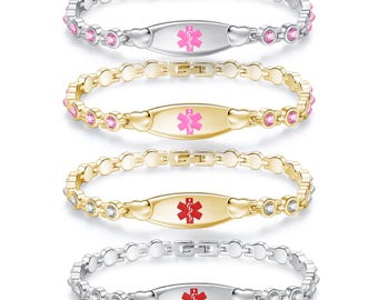 May include: Four medical alert bracelets in silver and gold tones. Each bracelet features a central ID plate with a medical symbol and a chain-link design with decorative stones. The medical symbols are in pink and red.