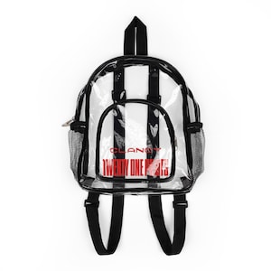 May include: Clear backpack with black trim, straps, and mesh side pockets. The backpack features white vertical stripes and the words "CLANCY TWENTY ONE PILOTS" in red. The backpack has a top handle and adjustable shoulder straps.