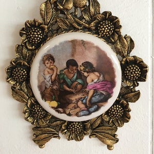 Oval picture by Murillo on porcelain in ornate bronze frame