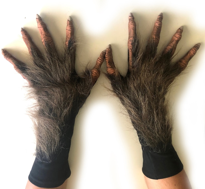 May include: A pair of brown furry werewolf hand gloves with black wrist cuffs. The gloves have realistic looking fingers and are perfect for Halloween costumes.