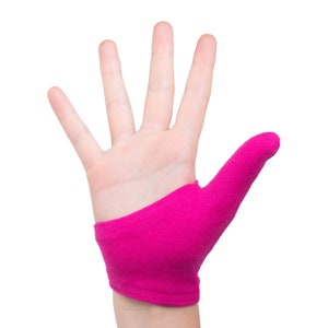 May include: A pink thumb protector for a finger, worn on the right hand.