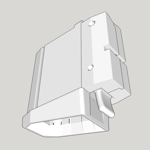 May include: A white, geometric, three-dimensional object with a rectangular body and angled sides. It features a protruding handle-like element and several small, vertical lines at the base. Two circular indentations are visible on the side.