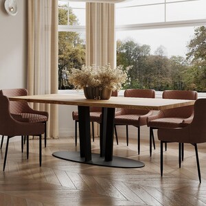 May include: A wooden dining table with a black metal base and six brown leather chairs. The table is set with a vase of dried flowers.