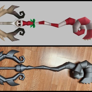 May include: A 3D printed replica of the "Santa's Little Helper" keyblade from the Kingdom Hearts video game series. The keyblade is made of gray plastic and features a detailed design with a curved handle and a pointed tip.