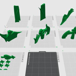 May include: A selection of green 3D-printed objects, including abstract shapes and forms, arranged on a grid. The objects vary in size and design, with some resembling organic structures. The image is taken from a top-down perspective.