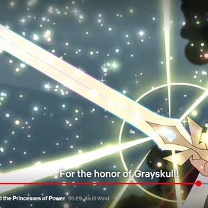 May include: A glowing golden sword with a blue gem in the hilt. The sword is surrounded by a bright light and a starry background. The text "For the honor of Grayskull!" is visible at the bottom of the image.