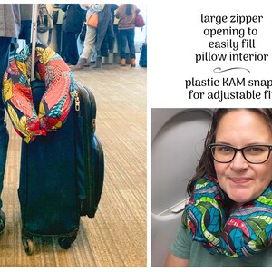May include: A colorful travel neck pillow with a vibrant floral pattern is draped over a rolling suitcase. The pillow has a large zipper opening and plastic snaps for an adjustable fit. The image also shows a person wearing the pillow.