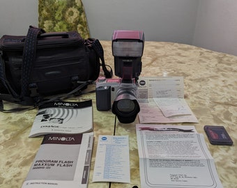 Minolta Dimage 7 (5.2 mega pixels) with Maxxum Flash 5600 HS both original users manual,warranty, sales receipt, paperwork, samsonite bag