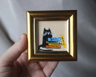 Peinture à l'huile de livres de chat noir 2 x 2 original encadré