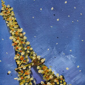 May include: A painting of the Eiffel Tower in Paris, France. The tower is painted in a light purple color with yellow and orange accents. The background is a blue sky with white dots.