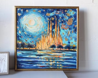 May include: A painting of a golden cathedral with a blue sky and a bright moon. The cathedral is reflected in the water below. The painting is framed in gold.