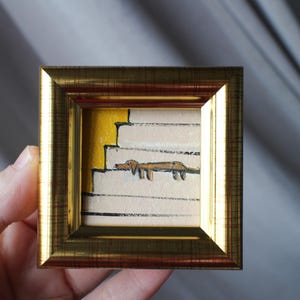 Mini painting a brown dachshund dog is sleeping on the stairs oil painting framed 2x2 in Original Handmade painting