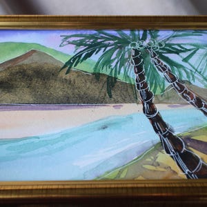May include: Watercolor painting of a tropical beach scene with two palm trees in the foreground and a mountain in the background.