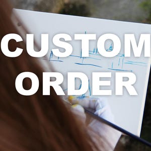 May include: A white canvas with the words "CUSTOM ORDER" in large, bold, white letters. A hand wearing a white glove is painting a blue and yellow design on the canvas with a paintbrush.