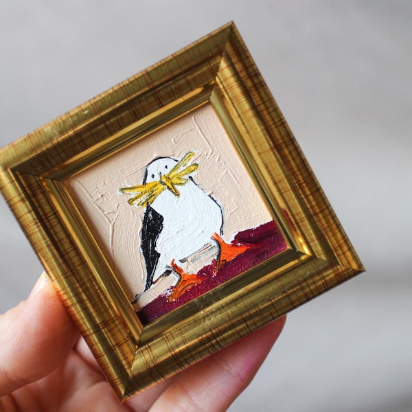 A seagull stealing a french fry oil painting framed 2x2 the gull stole the fries Wall Art