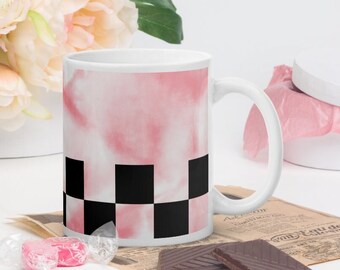 Black checkerboard pattern mug on pastel pink tie dye background, decorative cup, coffee cup, tea cup, checkerboard print, kitchen accessory