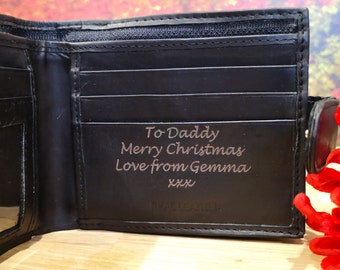 May include: Black leather wallet with a personalized inscription that reads "To Daddy Merry Christmas Love from Gemma xxx".