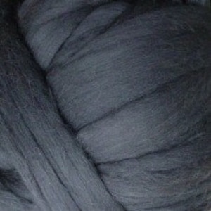 May include: A large ball of dark gray wool yarn.