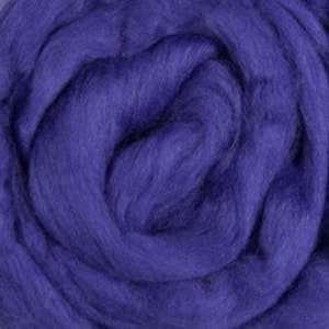 May include: A close-up of a bundle of purple wool roving. The wool is soft and fluffy, and it is perfect for spinning, felting, or other fiber crafts.
