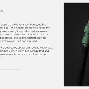 May include: A close-up of a walking stick with a dark wooden shaft and green leather accents. The stick features a green leather strap and a gold-colored ring. The text "ART WALKING STICKS" is visible.