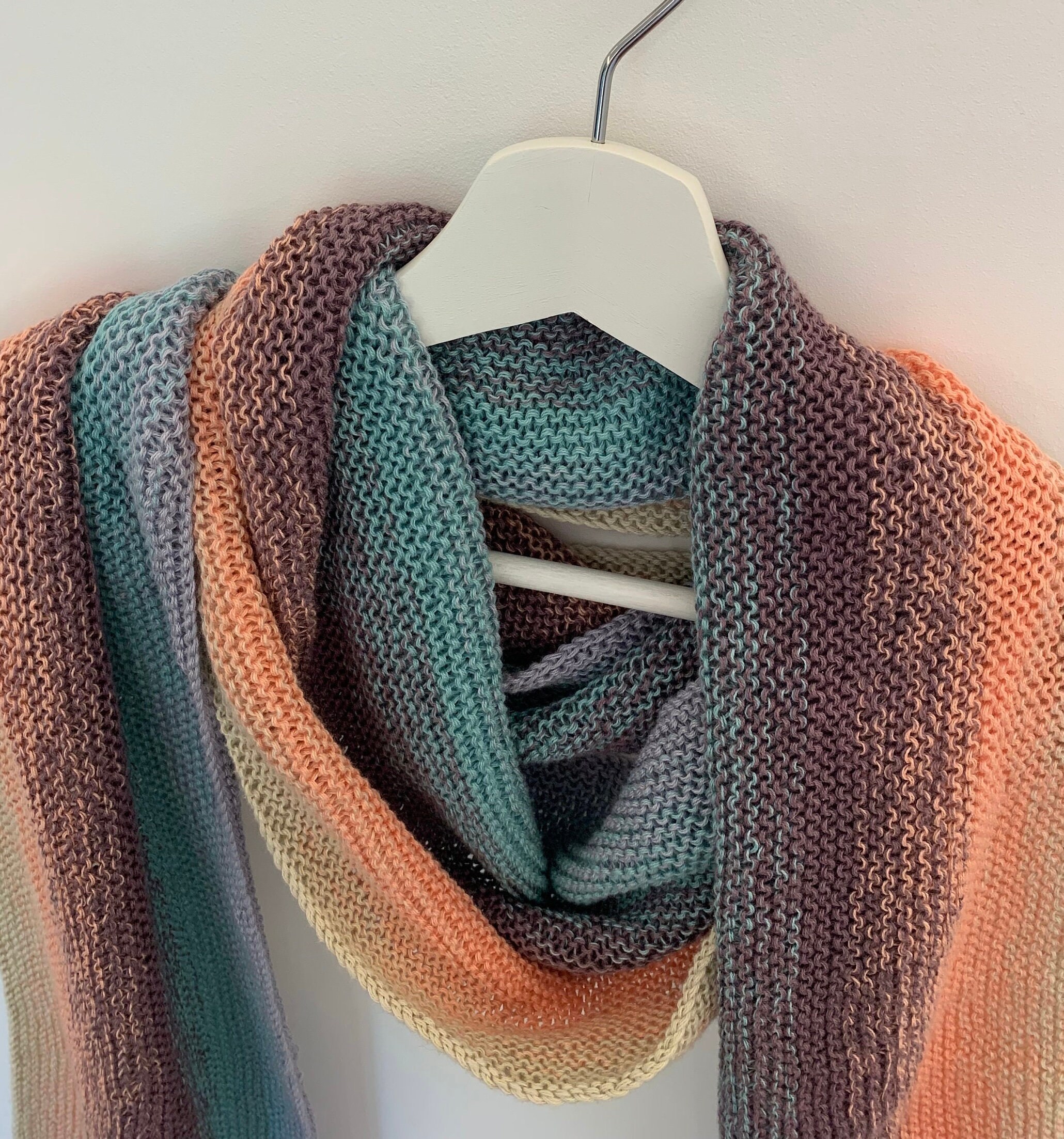 Handknitted cotton acrylic mix in pastel sunrise colours.