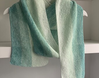 Handknitted cotton scarf in pale greens