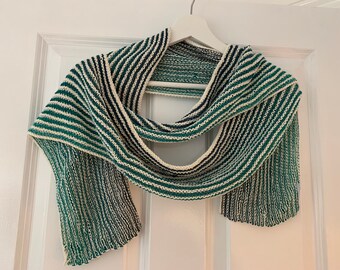 Hand knitted cotton scarf with a fading green stripe and cream background