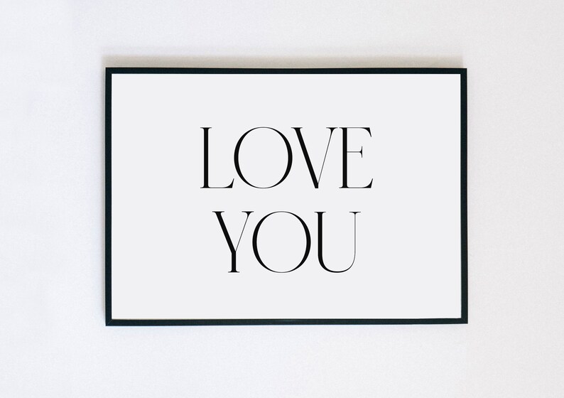 May include: A black framed print with the text "LOVE YOU" in white.