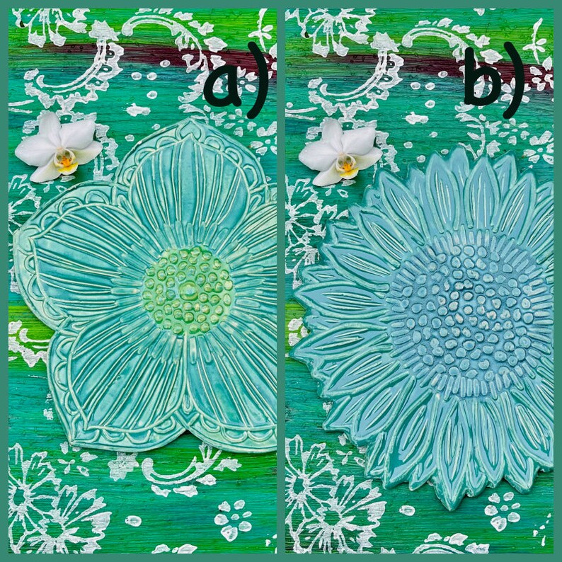 May include: Two turquoise ceramic flower-shaped decorative pieces. One is a stylized flower, the other a sunflower. Both are on a green background with white floral patterns and a white orchid. The image is labeled with the letters "a)" and "b)".