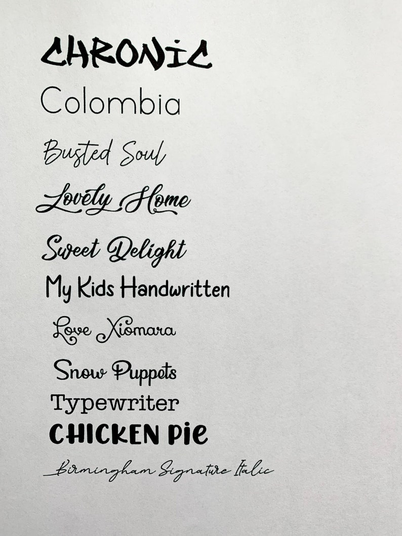 May include: A list of handwritten words in black ink on a white background. The words include "Chronic", "Colombia", "Busted Soul", "Lovely Home", "Sweet Delight", "My Kids Handwritten", "Love Xiomara", "Snow Puppets", "Typewriter", "CHICKEN Pie", and "Birmingham Signature Italic".