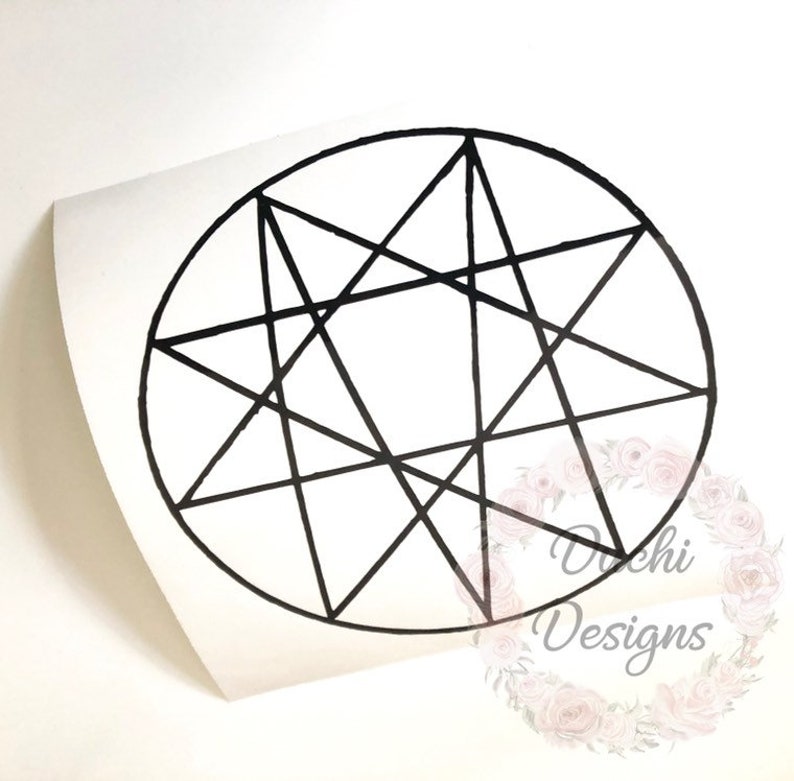 May include: A black nine-pointed star design inside a circle, presented on a white background. The image is a sticker or decal, with a curved edge. The text "Dochi Designs" is visible in the lower right corner.