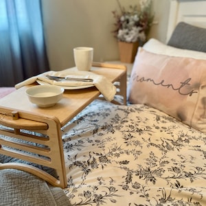 Large Adjustable lap desk being used as a breakfast tray on a bed. The lap desk in on the highest setting.  The desk is supporting a plate, bowl and mug with ample room to spare.  Great gift idea for Hospital Recovery or Get Well Gift