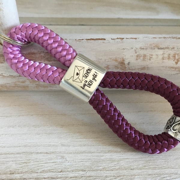 Keyring made of sailing rope with intermediate piece with engraving "It's nice that you exist" with silver-plated sliding bead, granny pink/aubergine