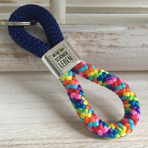 Key ring made of sailing rope with a silver-plated intermediate piece with engraving "Bring on the beautiful life", blue/rainbow mix