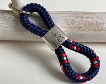 Key ring made of sailing rope with a silver-plated intermediate piece with engraving "Moin", dark blue/blue-red-white