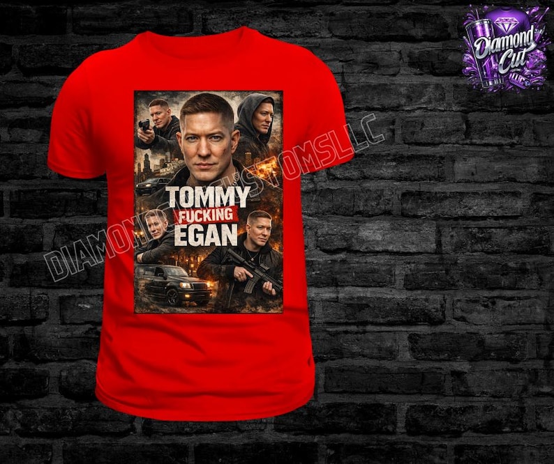May include: A red t-shirt featuring a graphic of a man with the text "Tommy Fucking Egan". The graphic includes images of the man and other people, with a car and city skyline in the background. The shirt has a crew neck.