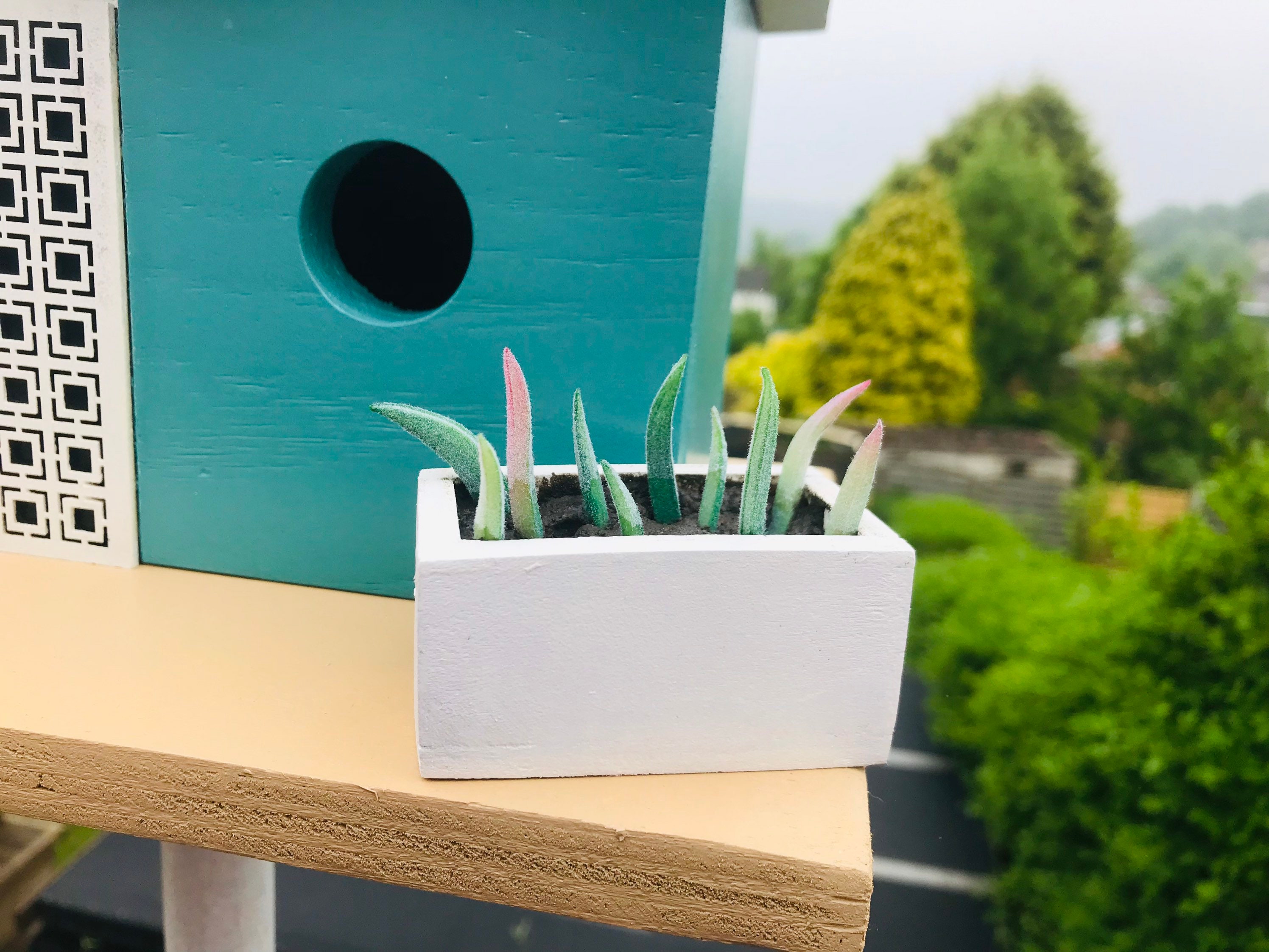 View of Palm Springs Style Birdhouse With a Butterfly Roof, Screen and Planter ...