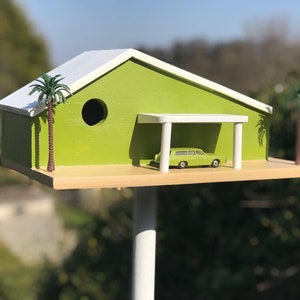 Mid-Century Modern 1950’s Palm Springs Modernist style bird house with period car and palm trees.
