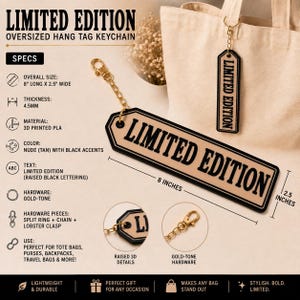 May include: An oversized hang tag keychain in nude tan with raised black lettering that reads LIMITED EDITION. The keychain features gold-tone hardware, including a chain and lobster clasp, measuring 8 inches long by 2.5 inches wide.