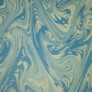 May include: Abstract pattern with swirling blue and cream colors. The design features a marbled effect, with flowing lines and organic shapes. The overall aesthetic is reminiscent of water or paint mixing, creating a dynamic and visually appealing texture.