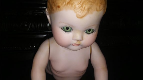 crawling creepy doll