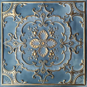 Floral Decorative PVC Faux Tin Ceiling Tiles in Smoked Gold. Drop In to an existing 2x2 grid system. Glue up.  Model #TD19