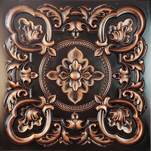 May include: A decorative ceiling tile with a copper finish and an intricate floral design. The tile has a dark brown background and a raised, ornate pattern.