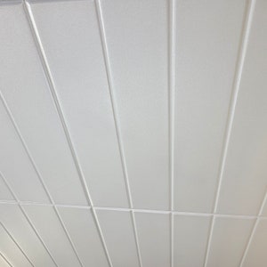 Styrofoam Ceiling Tiles in beadboard style to cover popcorn. Easy DIY Glue up installation. Model #RM-12