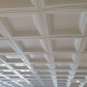 Sample of Coffered Faux Tin Decorative Ceiling Tile in White Matte. Drop In into the existing 2x2 grid system. Easy DIY installation.