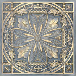 Könnte beinhalten: Eine dekorative Fliese mit einem goldenen und blauen floralen Design. Die Fliese hat ein erhabenes, geprägtes Muster und einen geometrischen Rand.