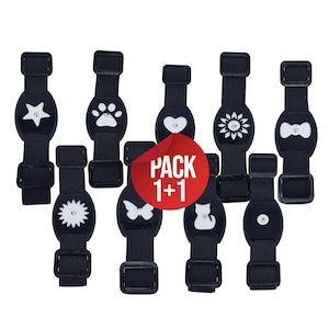 Può includere: Un pacchetto di 10 braccialetti neri e bianchi che brillano al buio con diversi design, tra cui una stella, un'impronta di zampa, un cuore, un fiore, un fiocco, una farfalla, un gatto e un design a spirale. Il testo "PACK 1+1" è stampato su un adesivo rosso.