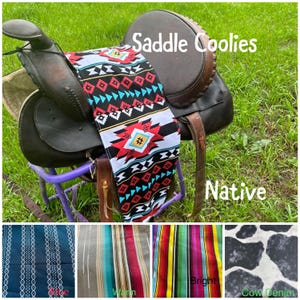 May include: A white ceramic mug with a black handle and the text "But First, Coffee" in a bold, black font. The mug is set against a neutral background, highlighting its simple design.