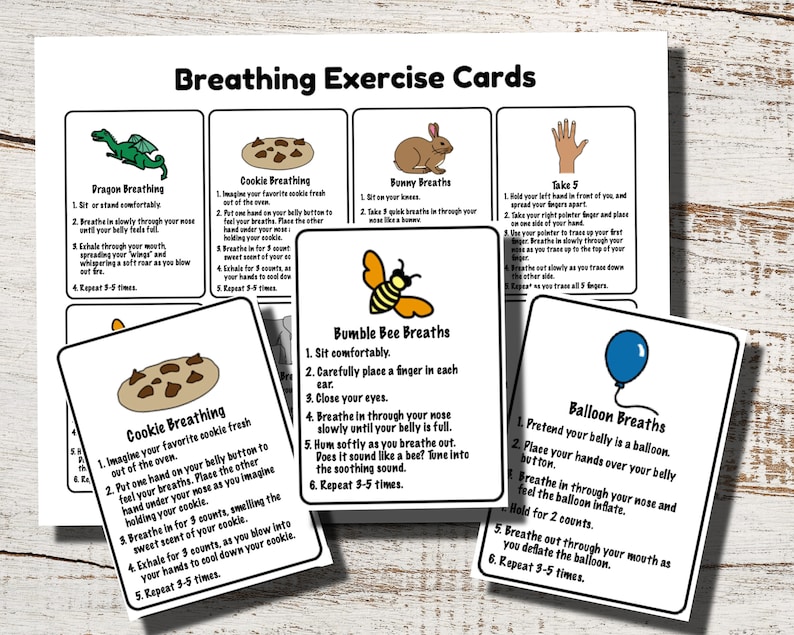 May include: A set of white cards with colorful illustrations and instructions for breathing exercises. The cards include "Dragon Breathing," "Cookie Breathing," "Bunny Breaths," "Take 5," "Bumble Bee Breaths," and "Balloon Breaths."